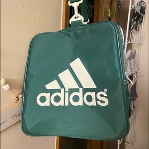 Adidas duffel bag.
24” L x 12” W x 12” H